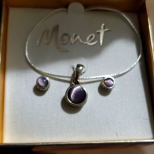 Silver necklace and earrings set with warm purple stone